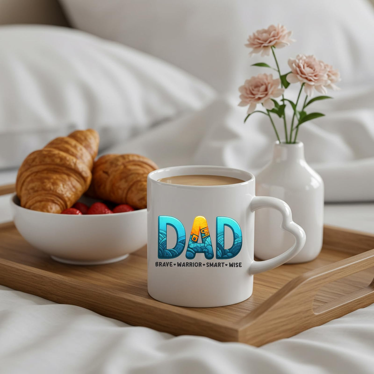 DAD Brave Warrior heart-handle mug on a breakfast tray with croissants and flowers