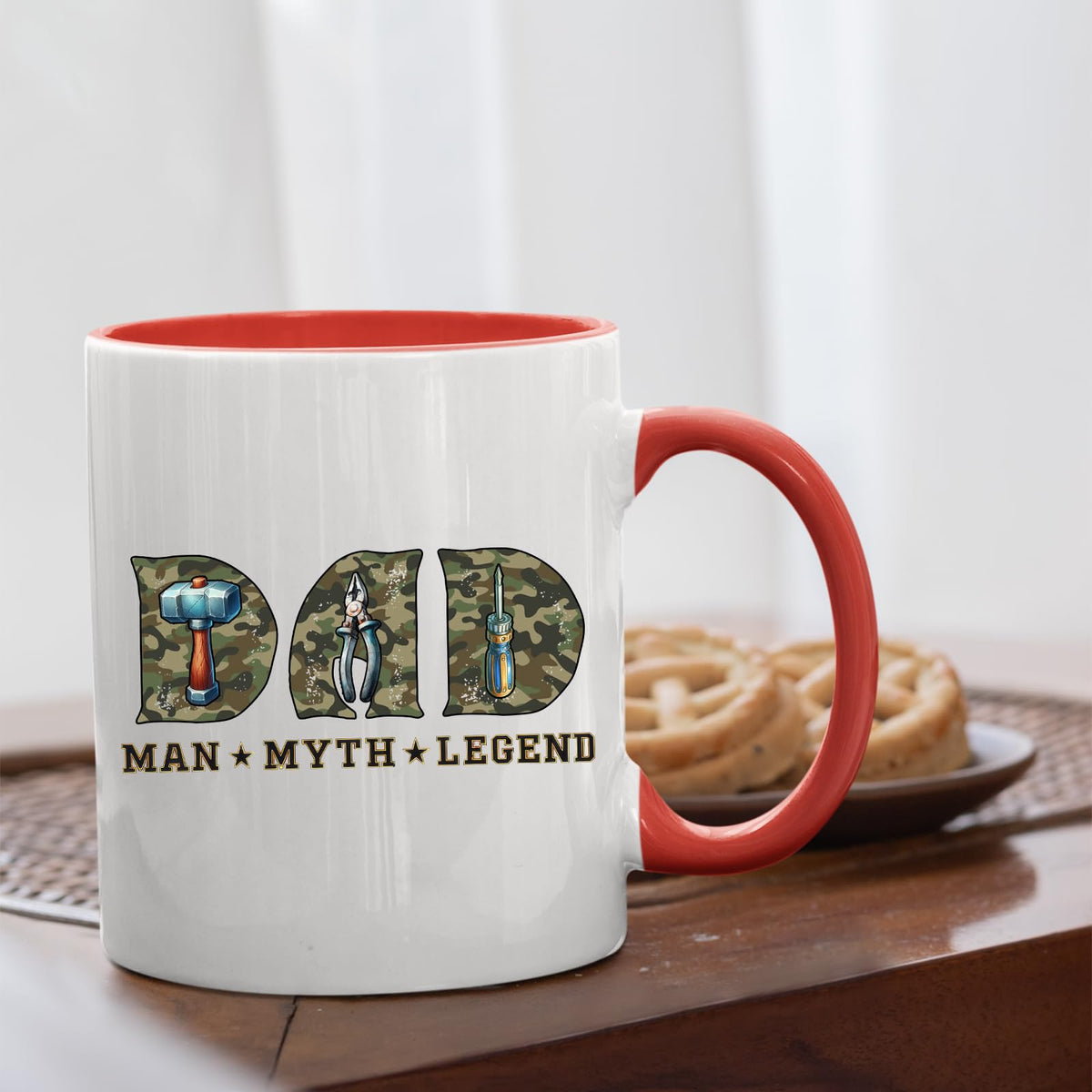 Dad Man Myth Legend tools mug with a red handle beside biscuits