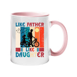 Colour handle mug with a dad and daughter with a bike in silhouette over retro stripes and “Like father, like daughter” – light pink handle and inside