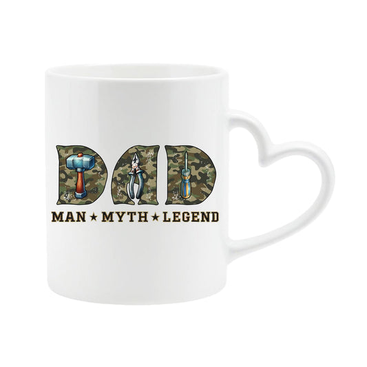 White heart-handle mug with camo “DAD” letters with a hammer, pliers and screwdriver above “Man ★ Myth ★ Legend”