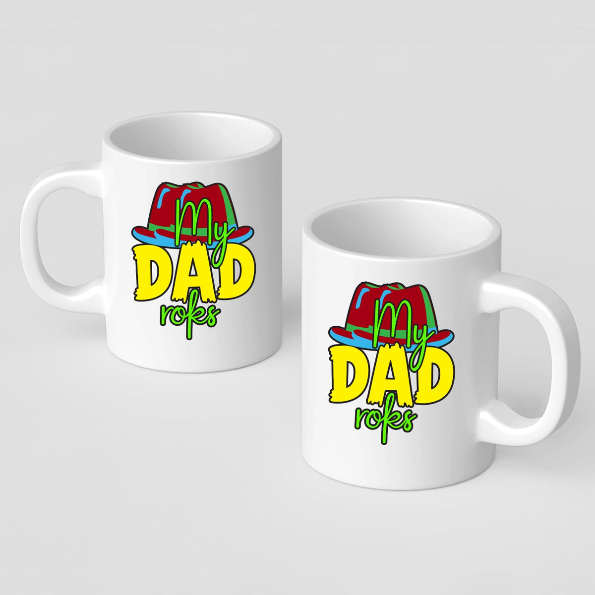 Two white mugs with the colourful My Dad Rocks hat design