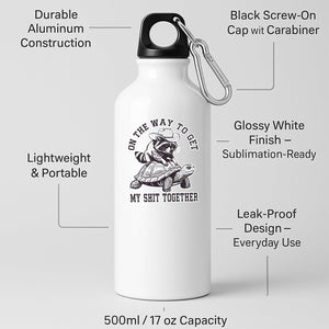 White aluminium water bottle with a raccoon in a cowboy hat riding a tortoise and “On the way to get my shit together”