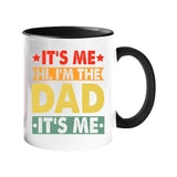 Colour handle mug with “It’s me, hi, I’m the dad, it’s me” in retro coloured banners – black handle and inside