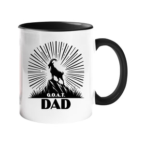 Colour handle mug with a mountain goat on a peak with a sunburst and “G.O.A.T. Dad” – black handle and inside