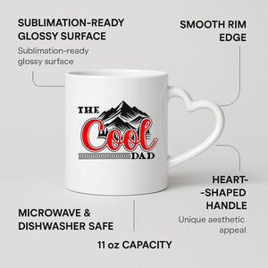 The Cool Dad mountains heart-handle mug on a marble counter with fruit
