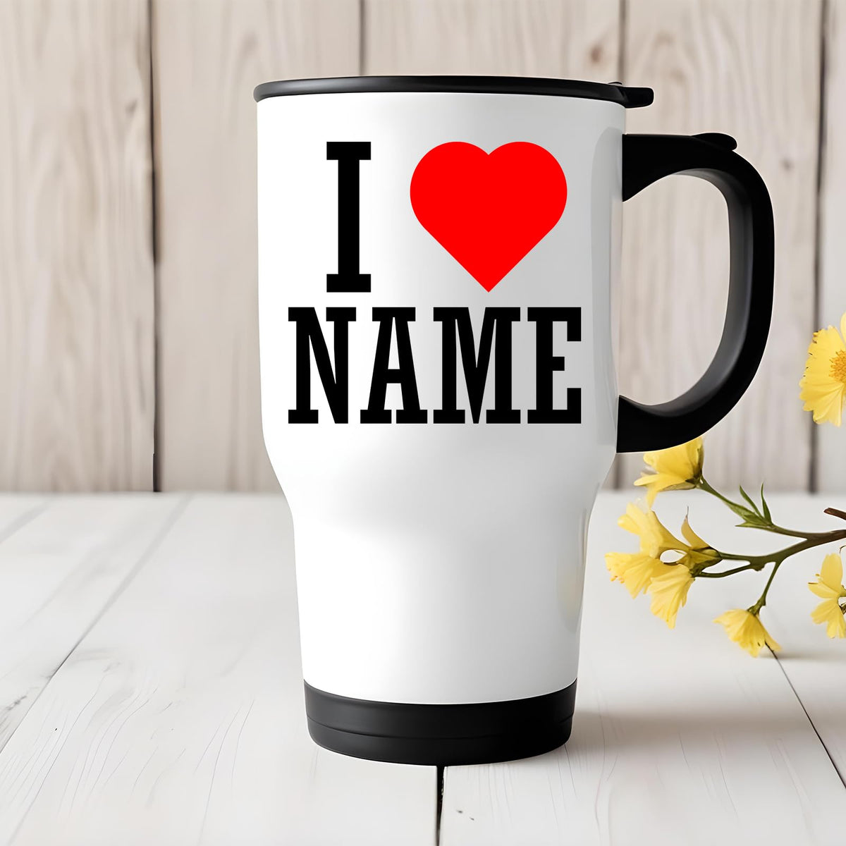 I love name travel mug on a white table with yellow flowers