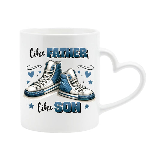 White heart-handle mug with a pair of blue high-top sneakers with hearts and “Like father, like son”