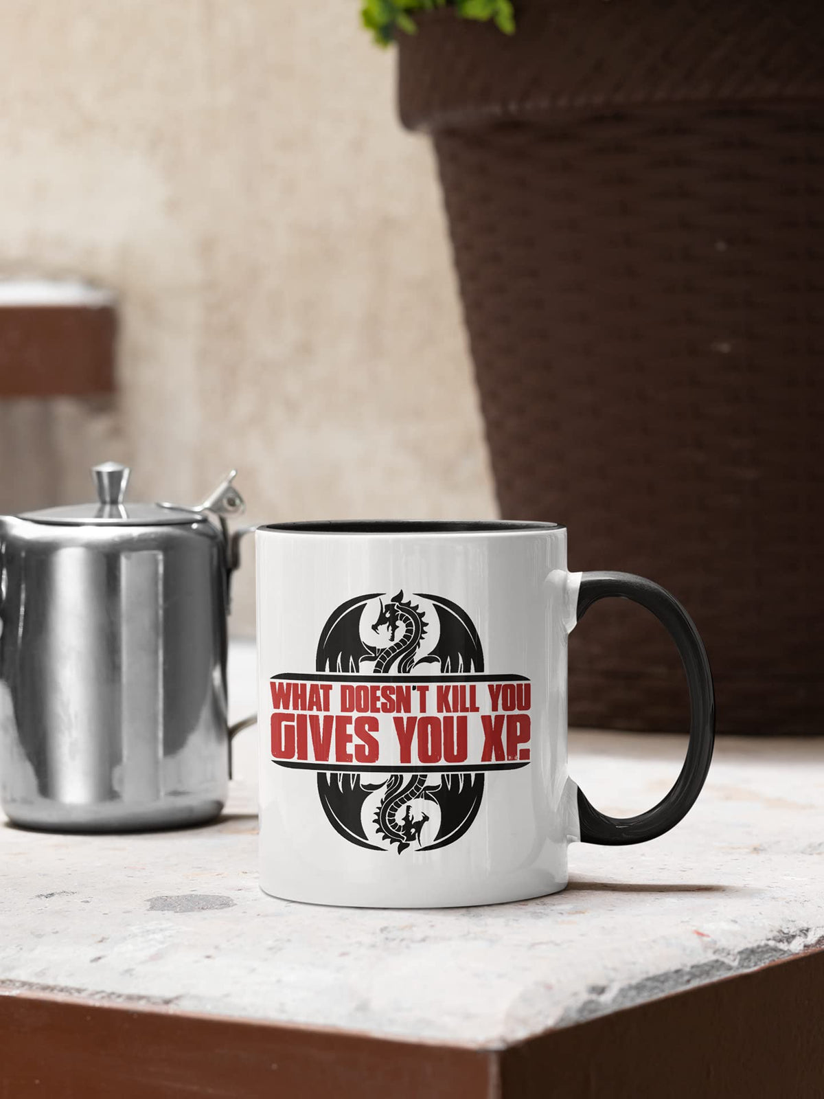 XP gamer mug next to a teapot