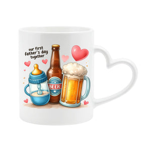 White heart-handle mug with a baby bottle, a beer bottle and a frothy pint with hearts and “Our first Father’s Day together”