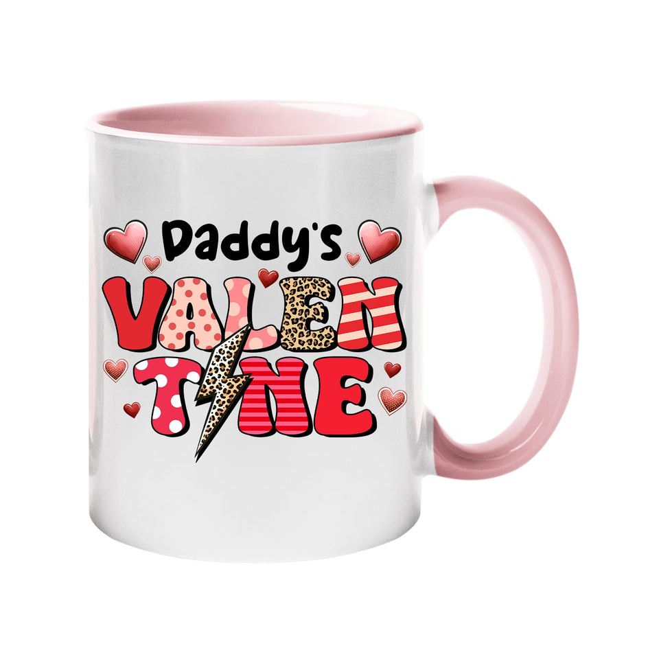 Colour handle mug with “Daddy’s Valentine” in patterned letters with hearts and a leopard lightning bolt – light pink handle and inside
