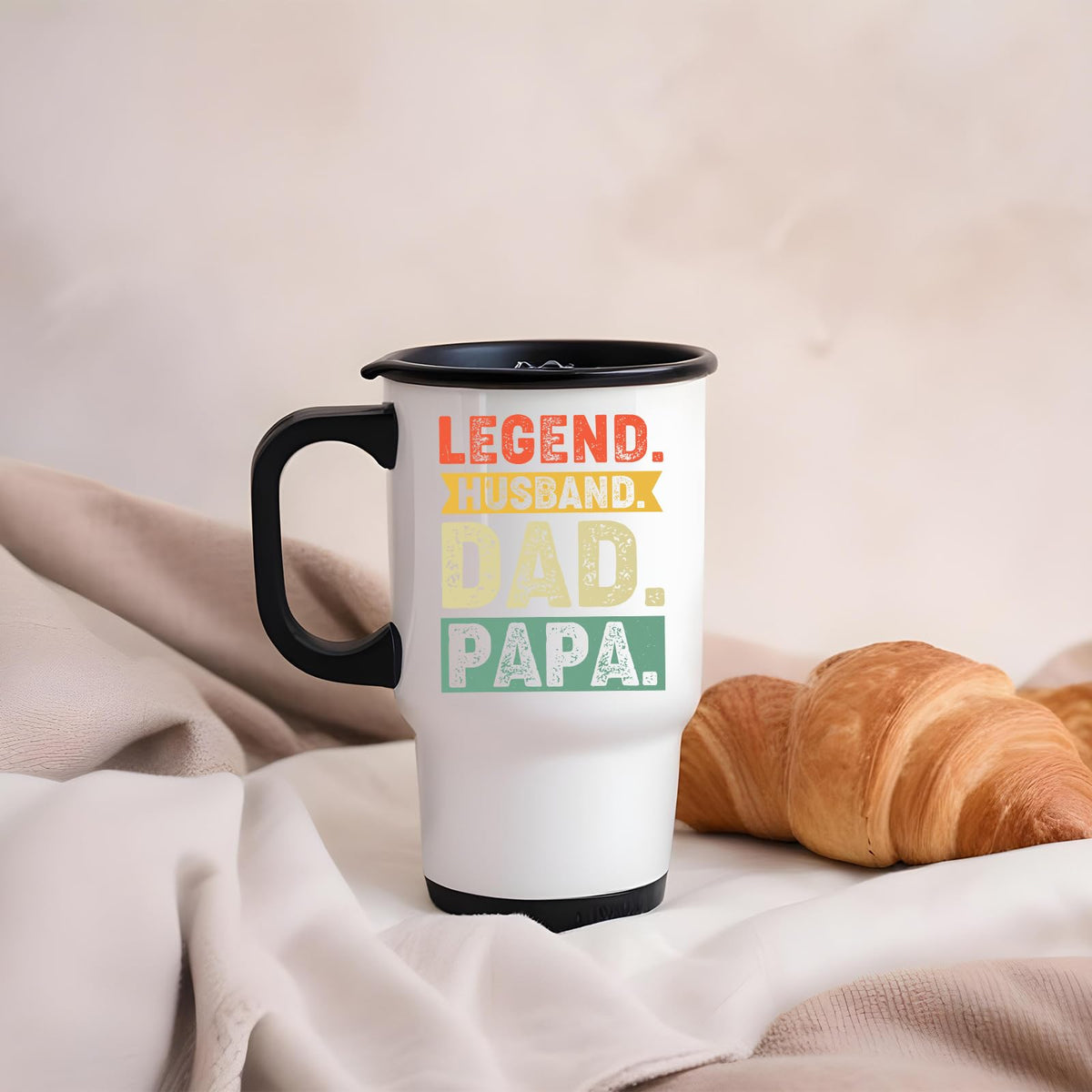 Legend Husband Dad Papa travel mug on a soft blanket beside a croissant