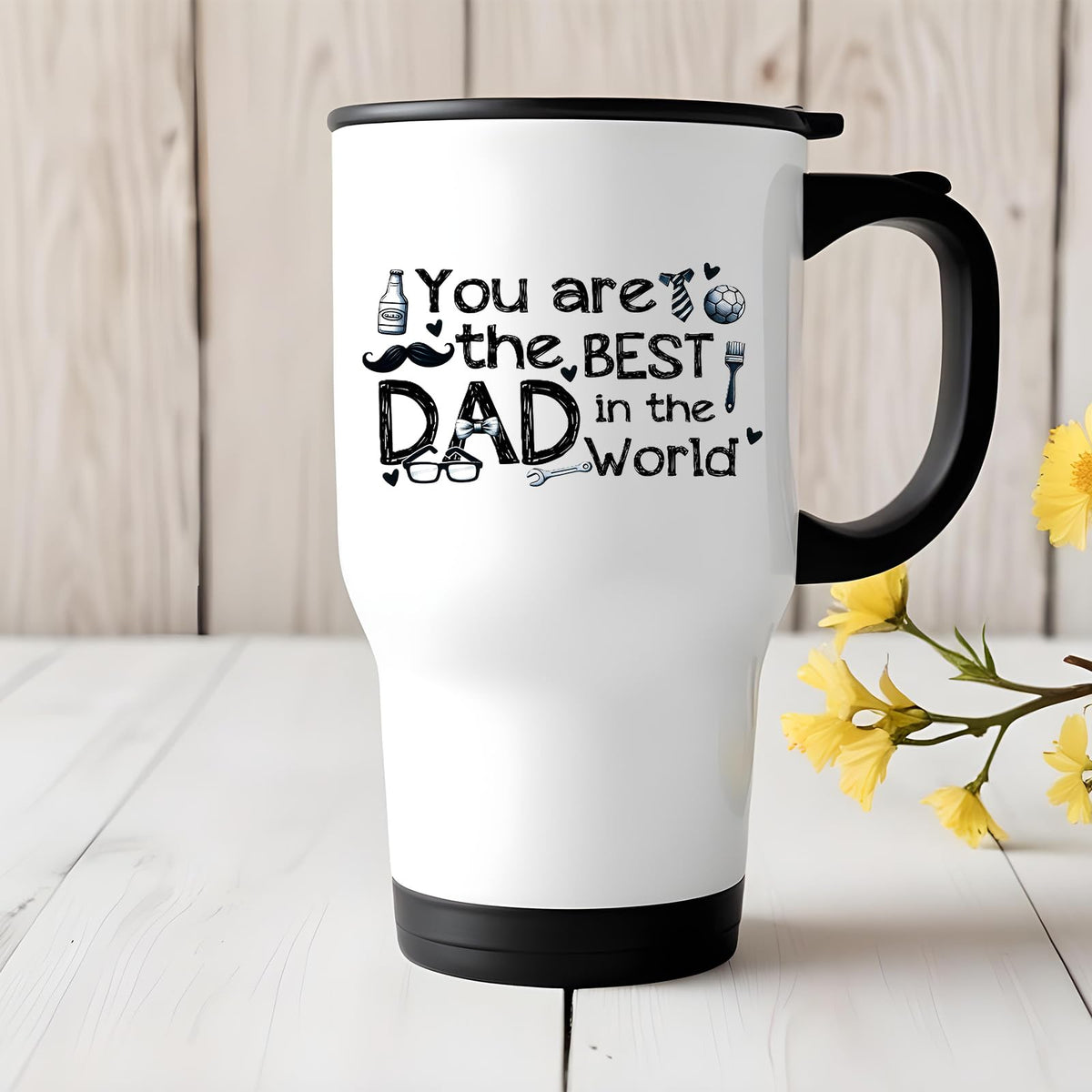 Best Dad in the World sketch travel mug on a white wooden table with yellow flowers