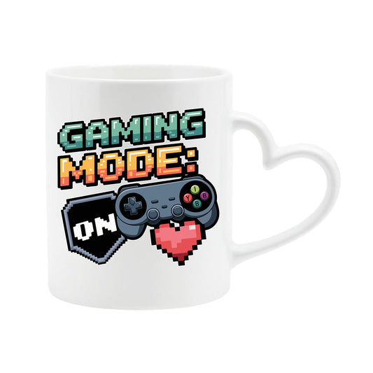 White heart-handle mug with “Gaming Mode: On” with a game controller and pixel heart