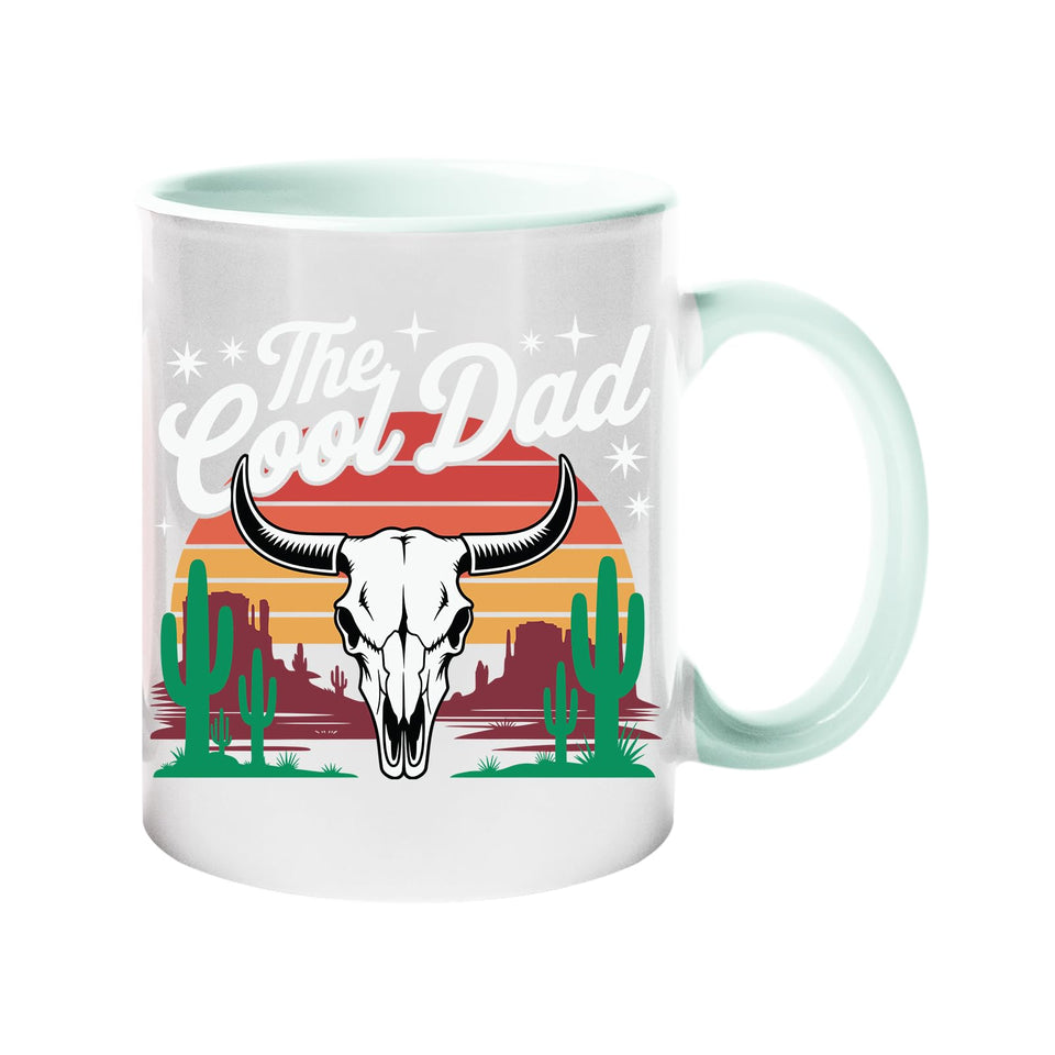 Colour handle mug with a bull skull, cacti and a retro desert sunset with “The Cool Dad” – lime handle and inside