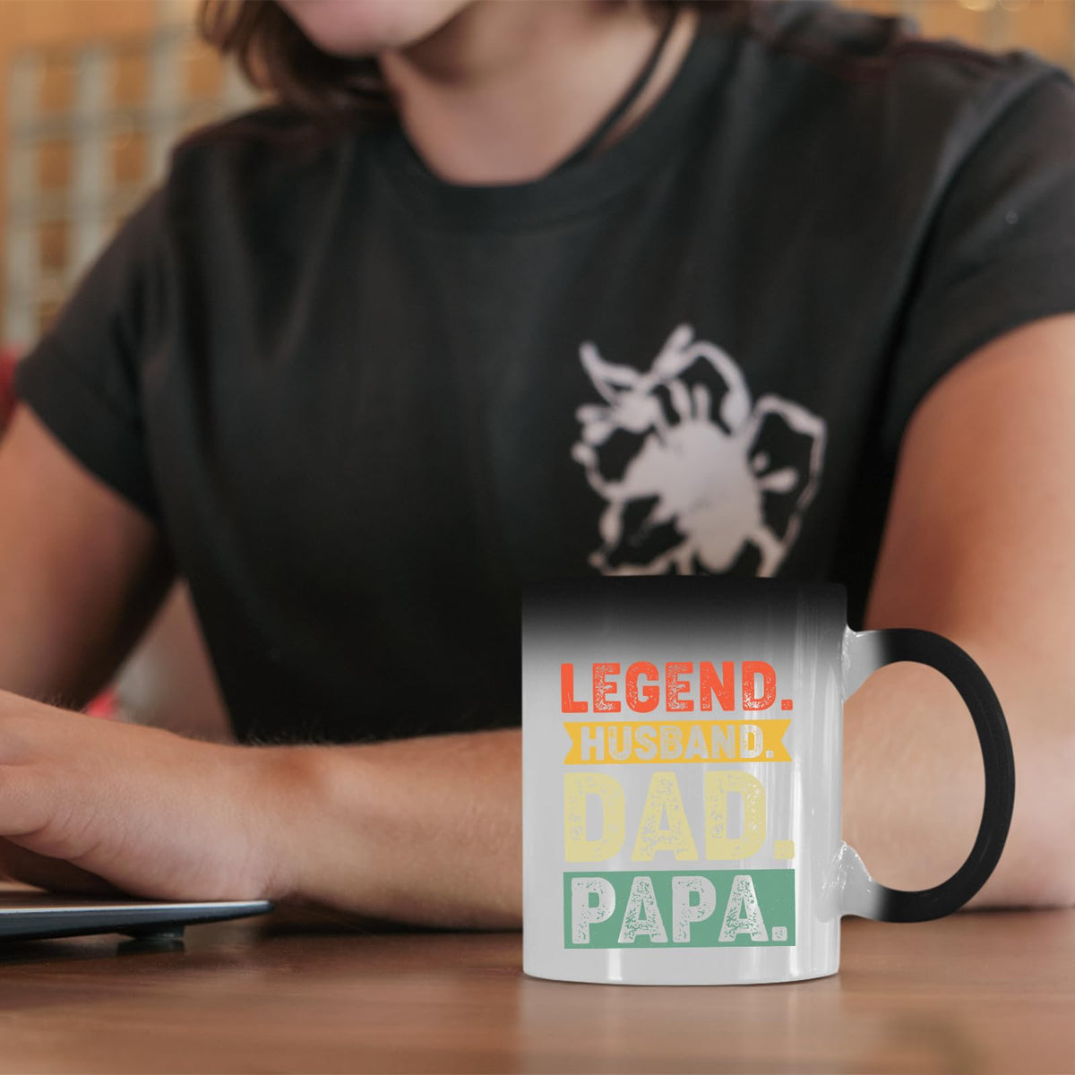 Legend Husband Dad Papa colour changing mug on a desk beside a laptop