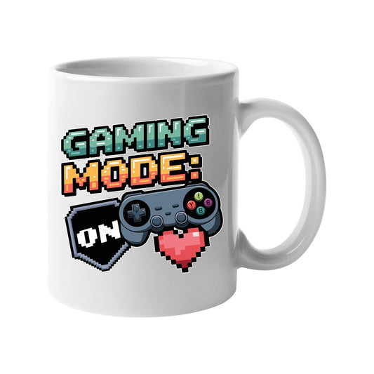 White 11oz mug with “Gaming Mode: On” with a game controller and pixel heart