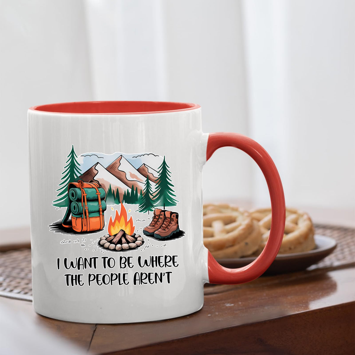 camping escape mug with a red handle beside biscuits