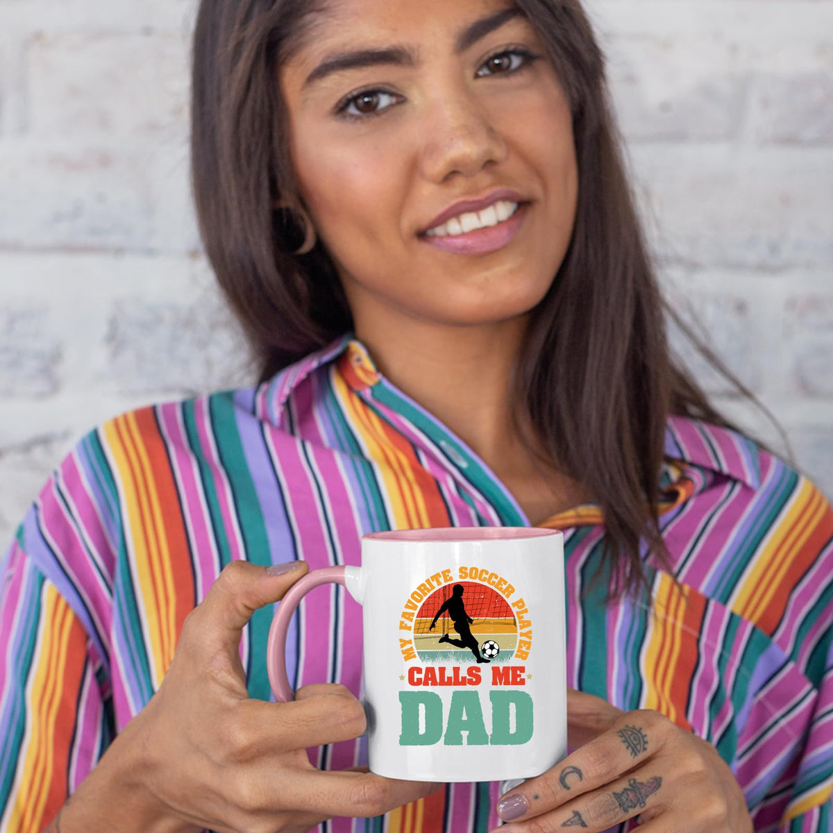 Woman in a striped shirt holding the Soccer Dad colour handle mug