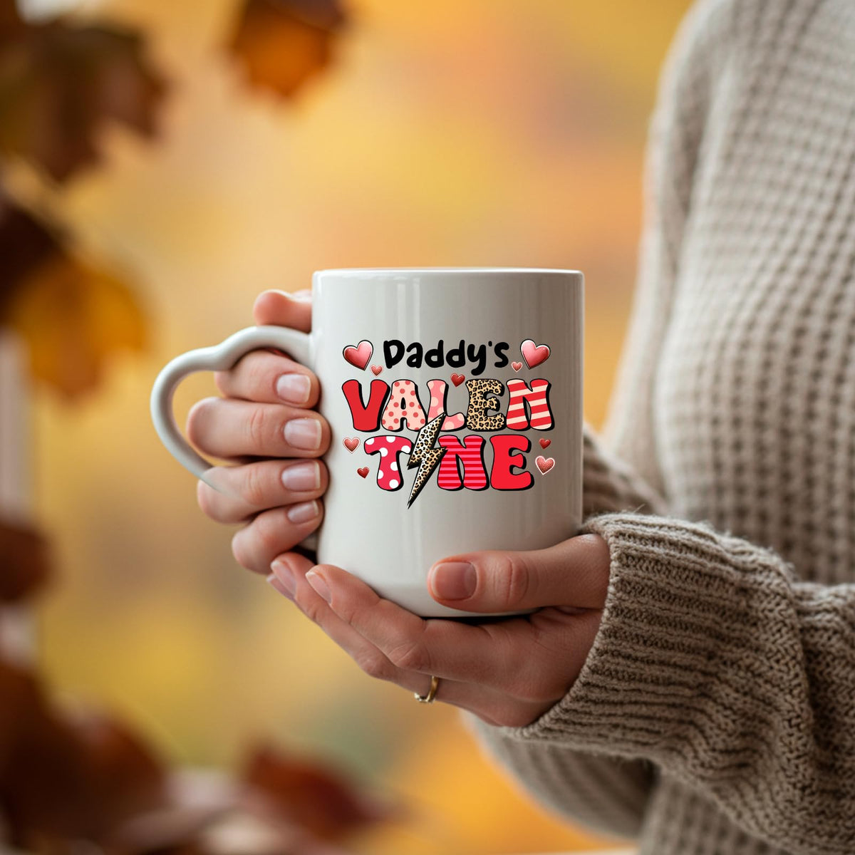 Hands holding the Daddy’s Valentine heart-handle mug