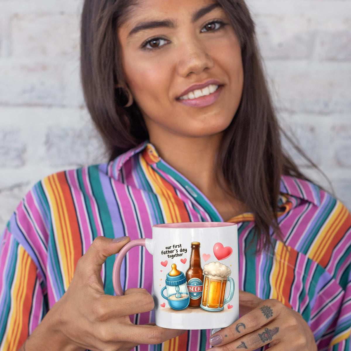 Woman in a striped shirt holding the First Father’s Day hearts colour handle mug