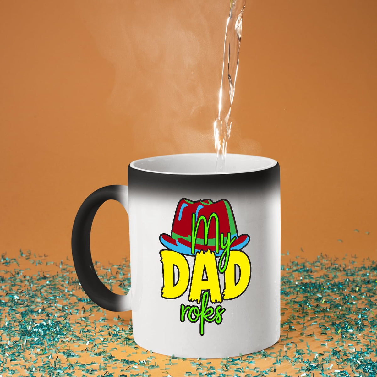 Hot water poured into the colour changing mug as the colourful My Dad Rocks hat design appears