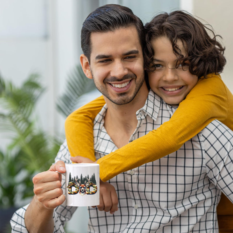 Smiling dad holding the Hunting Dad deer mug as his son hugs him