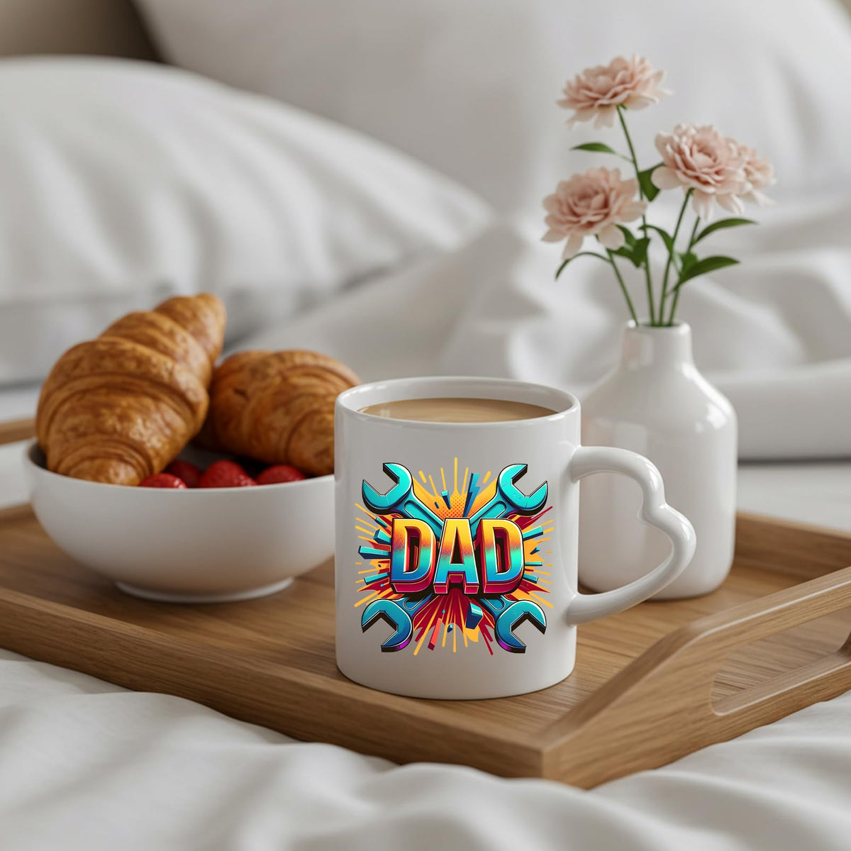DAD spanners heart-handle mug on a breakfast tray with croissants and flowers
