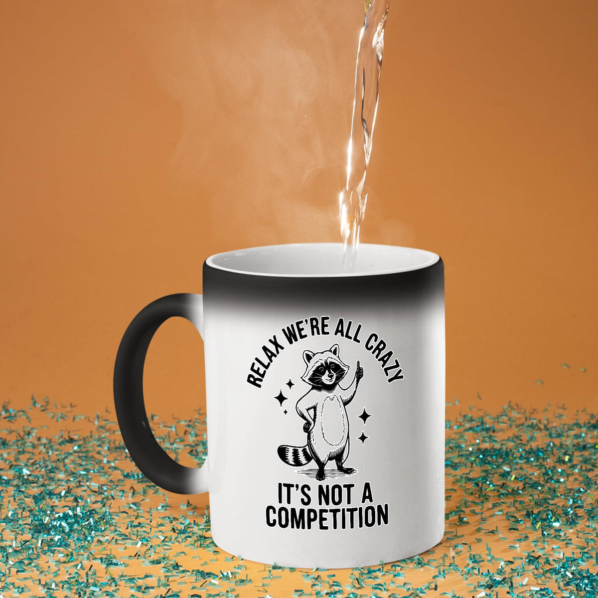 Hot water poured into the Relax We’re All Crazy raccoon colour changing mug as the design appears