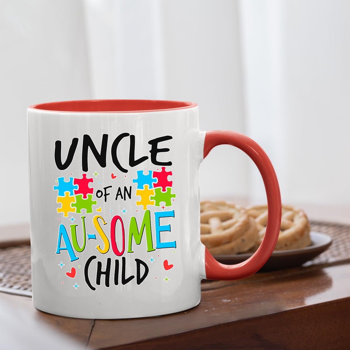 Uncle of an Au-Some Child mug with a red handle beside biscuits