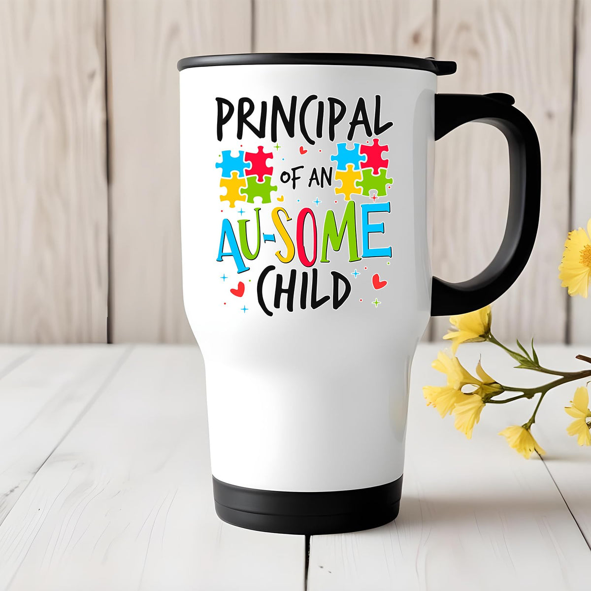 Principal of an Au-Some Child travel mug on a white wooden table with yellow flowers