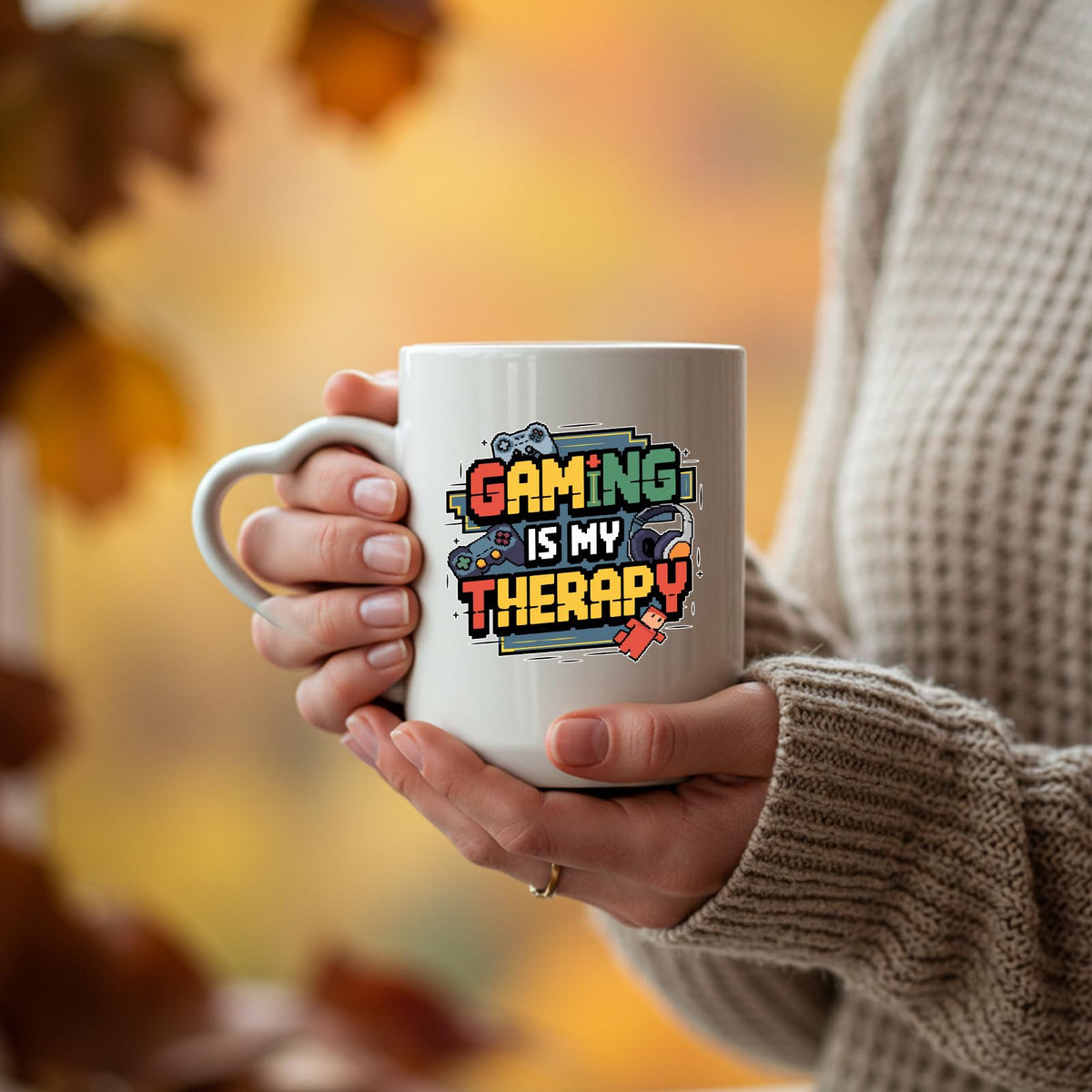 Hands holding the Gaming Is My Therapy heart-handle mug