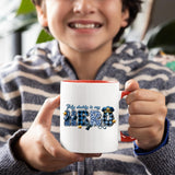 Smiling child holding the My Daddy Is My Hero police mug with a red handle