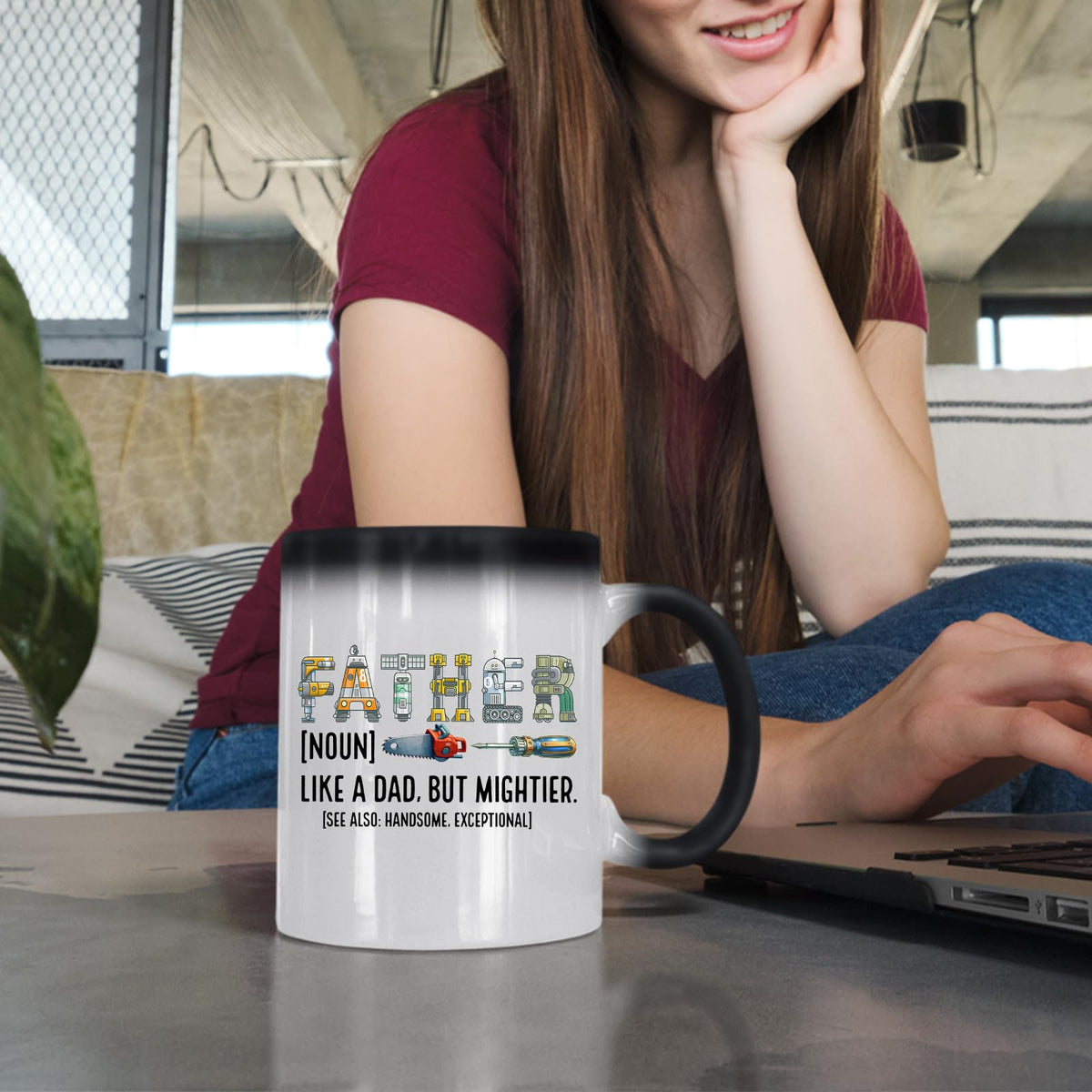 Woman at a laptop with the Father definition colour changing mug