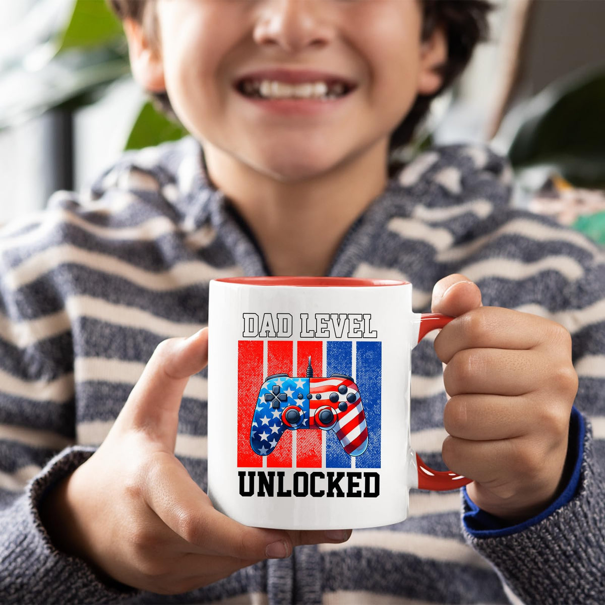 Smiling child holding the Dad Level Unlocked mug with a red handle