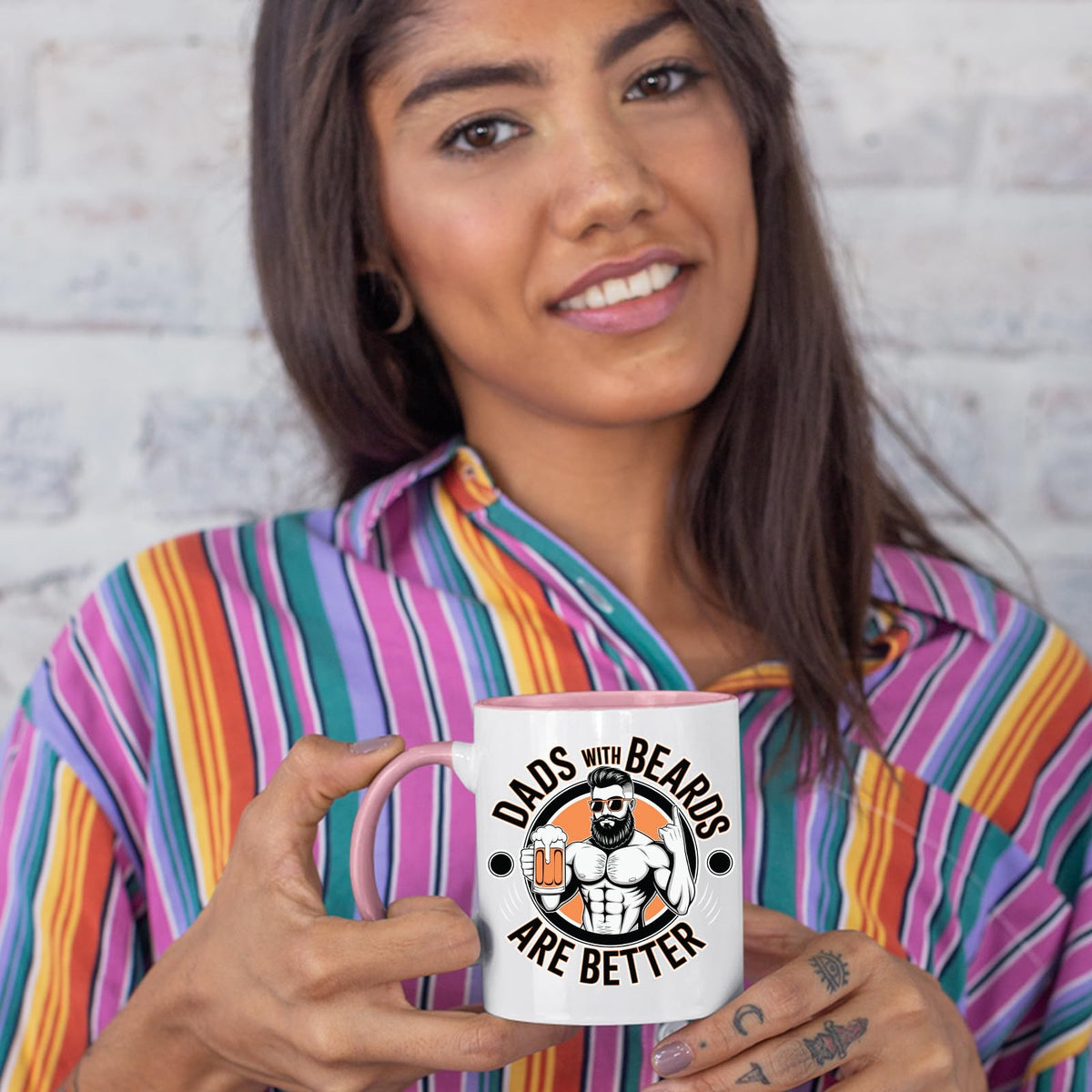Woman in a striped shirt holding the Dads with Beards colour handle mug