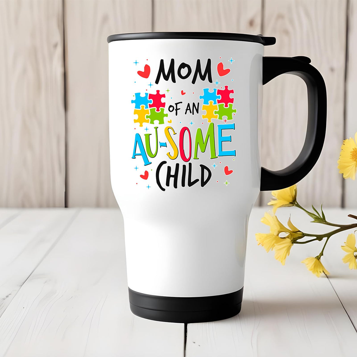 Mom of an Au-Some Child travel mug on a white wooden table with yellow flowers