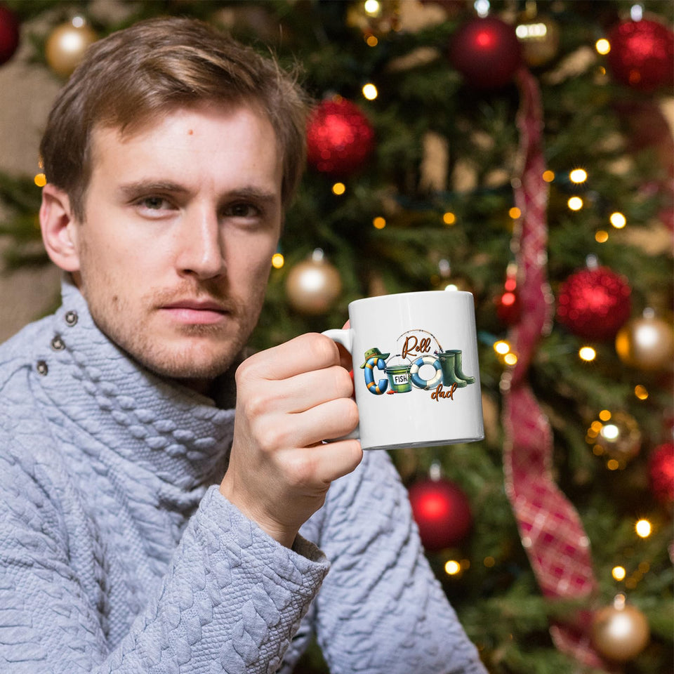 Man holding the Reel Cool Dad mug in front of a Christmas tree