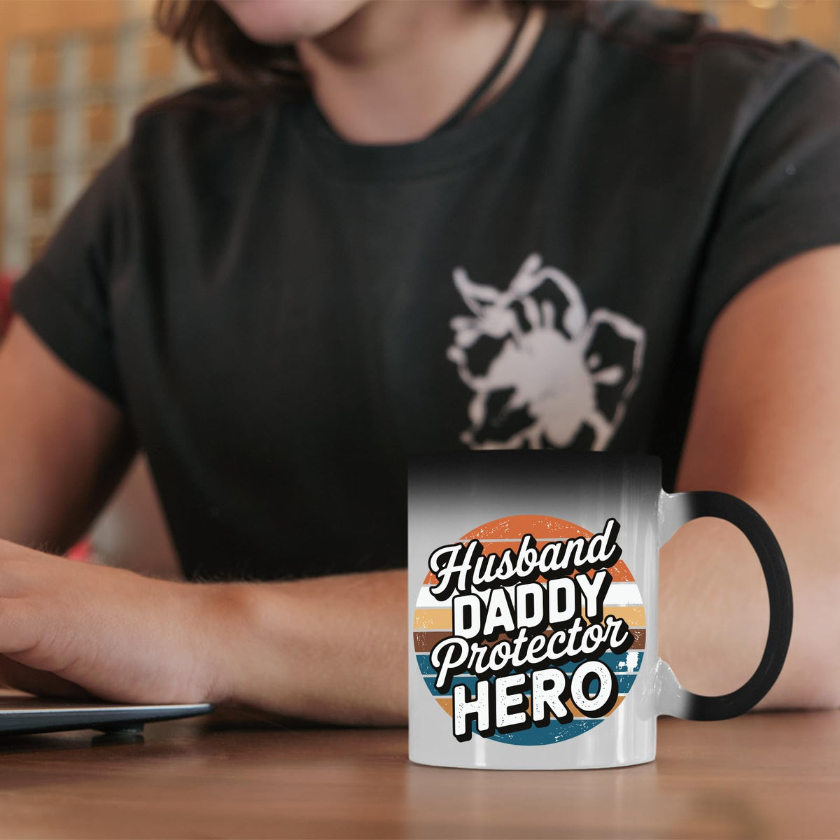 Husband Daddy Protector Hero retro colour changing mug on a desk beside a laptop