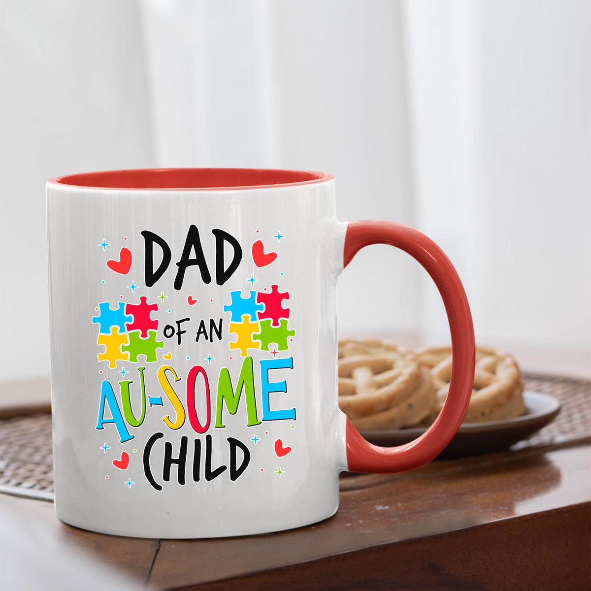 Dad of an Au-Some Child mug with a red handle beside biscuits
