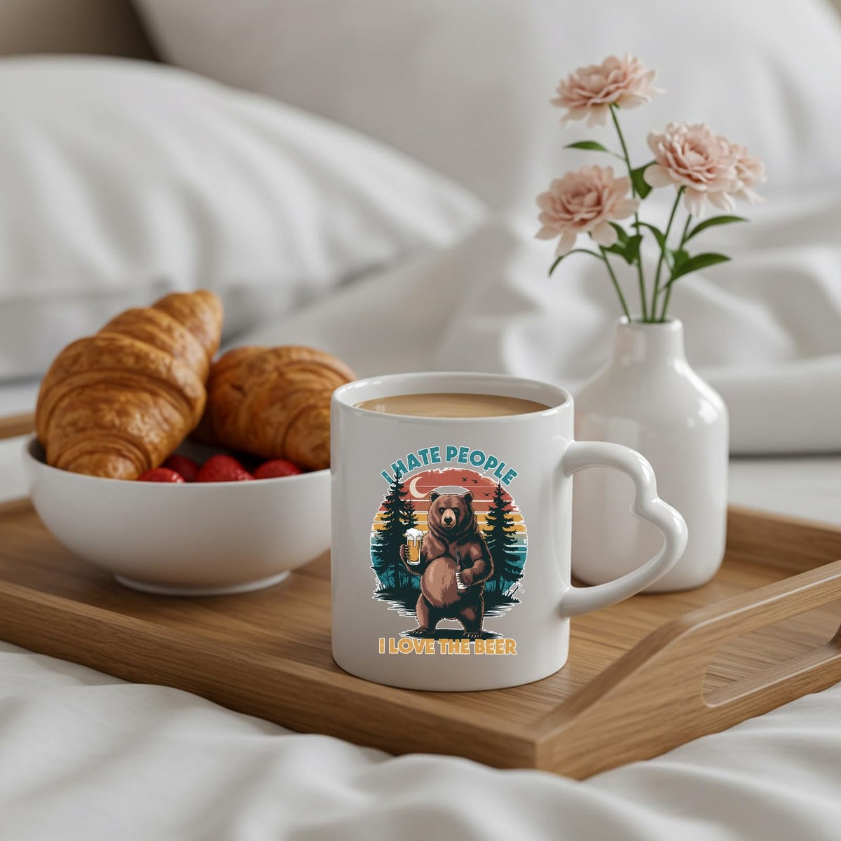 beer-loving bear heart-handle mug on a breakfast tray with croissants and flowers