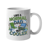 White mug with camping chairs, a cool box and a fishing rod with “Like a normal dad, but cooler”