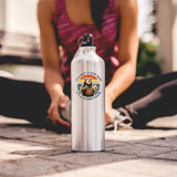 Dad Bod bear water bottle on the ground as a woman stretches