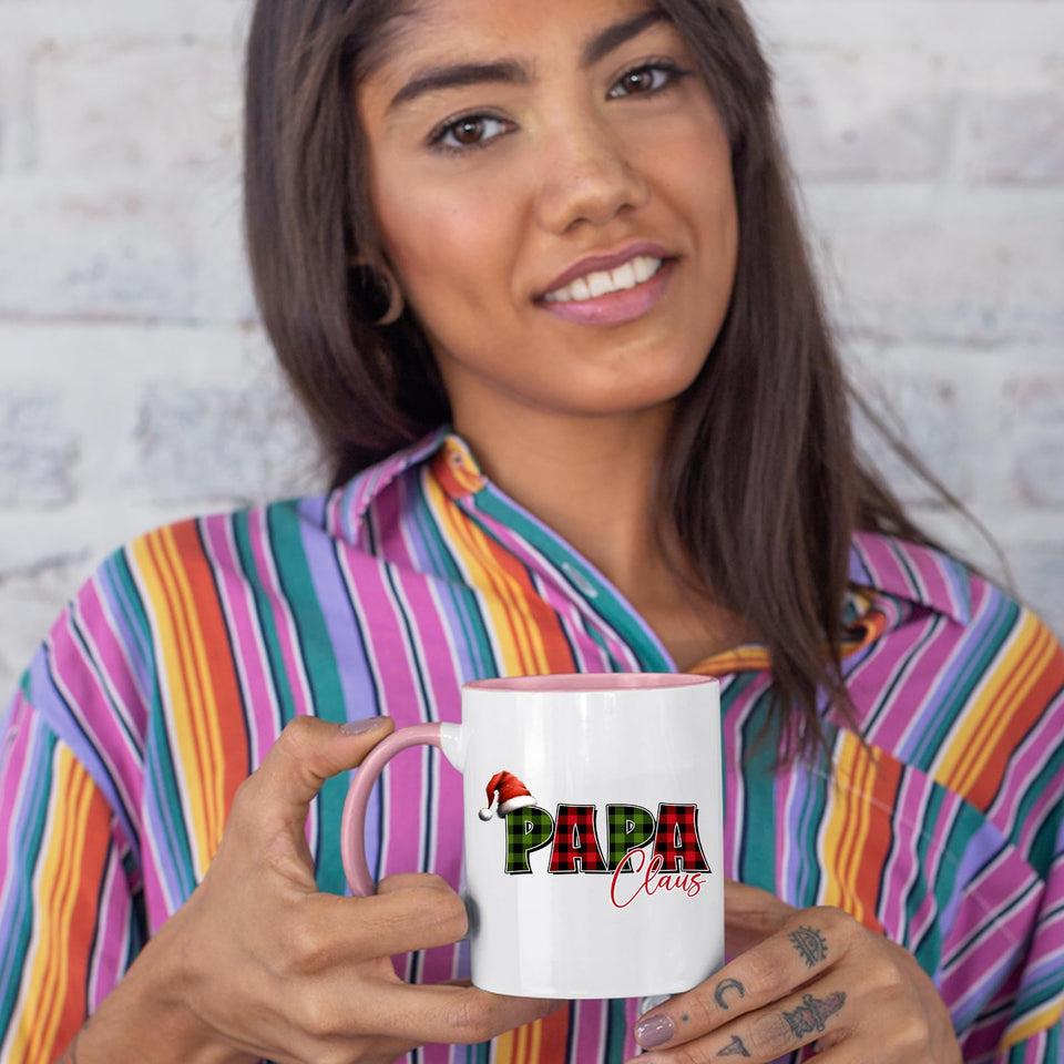 Woman in a striped shirt holding the Papa Claus colour handle mug