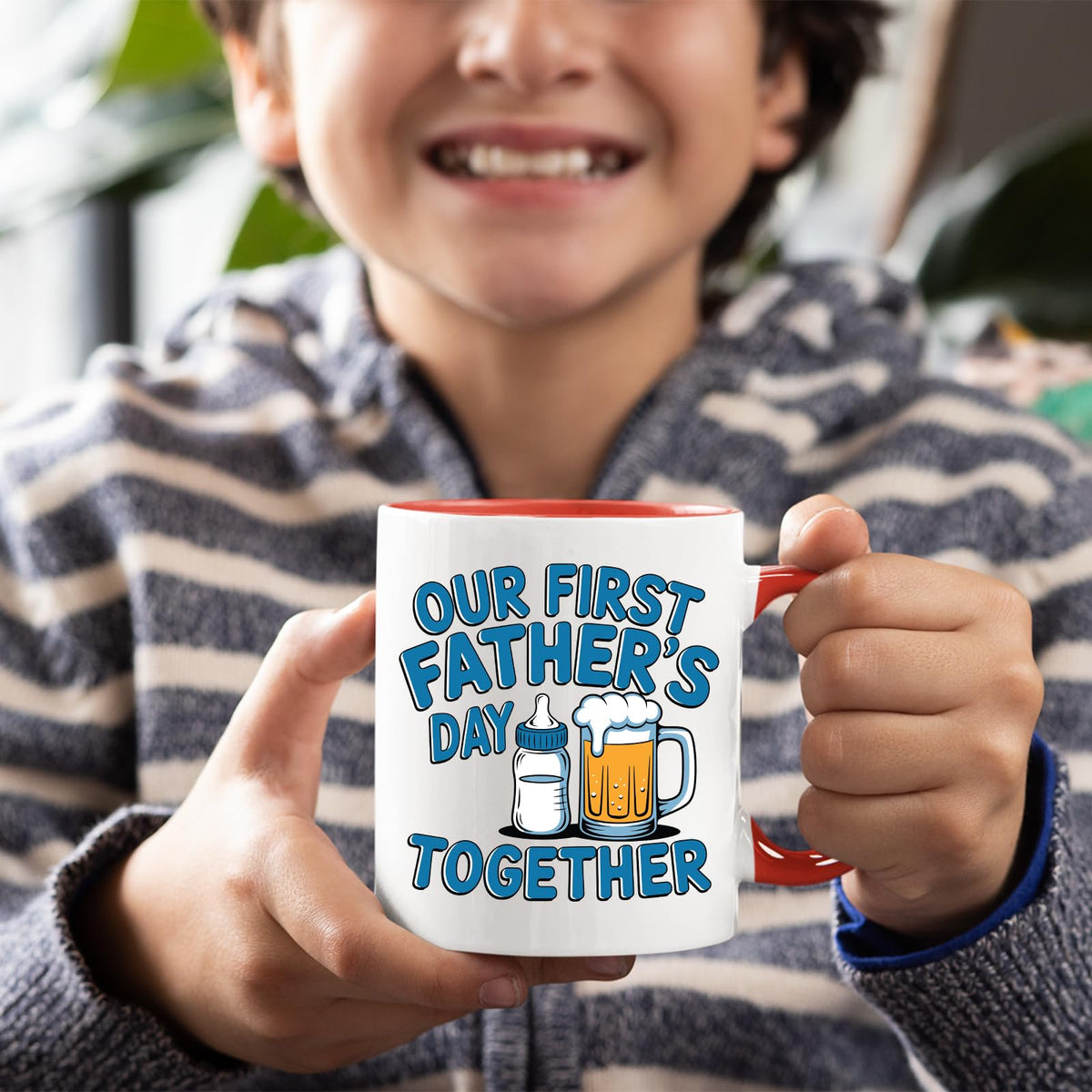 Smiling child holding the First Father’s Day bottle and beer mug with a red handle