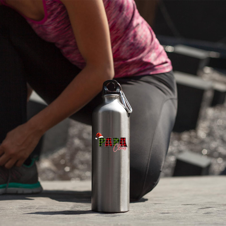 Papa Claus water bottle beside a woman tying her shoelace
