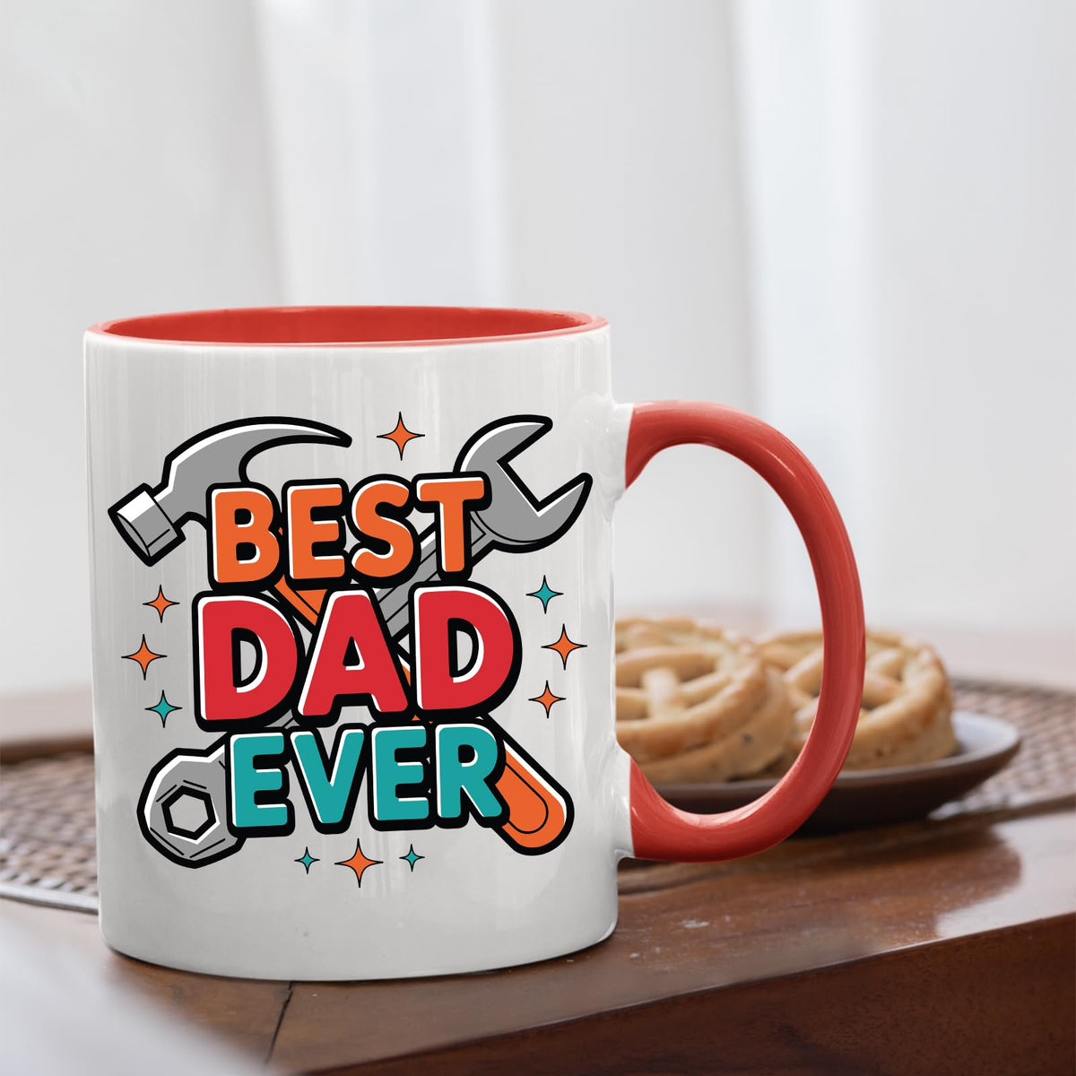 Best Dad Ever tools mug with a red handle beside biscuits