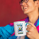 Smiling person in a colourful jacket holding the Dad Bod husky mug with a light green handle