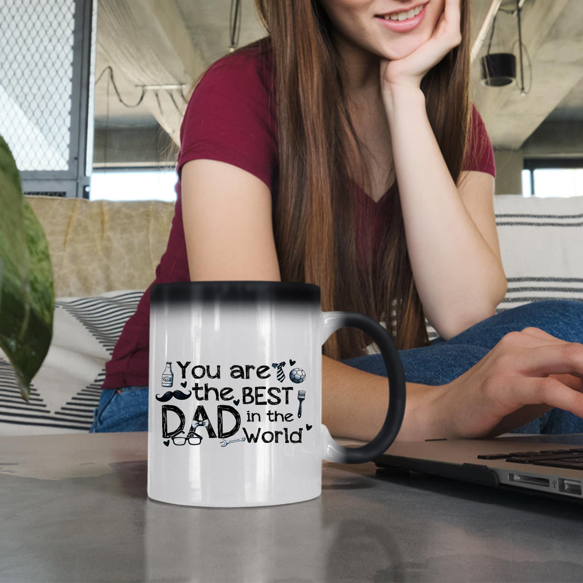 Woman at a laptop with the Best Dad in the World sketch colour changing mug
