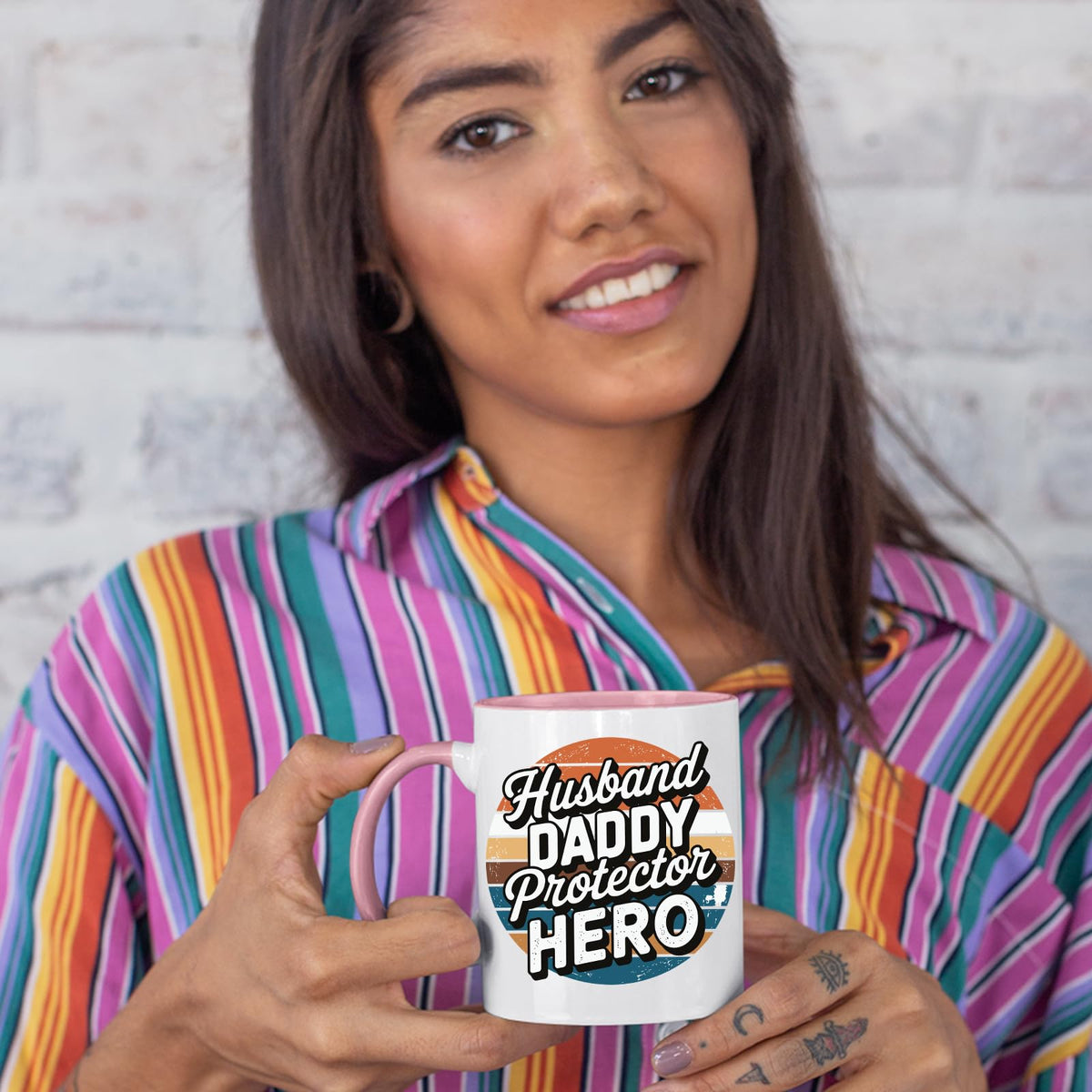 Woman in a striped shirt holding the Husband Daddy Protector Hero retro colour handle mug