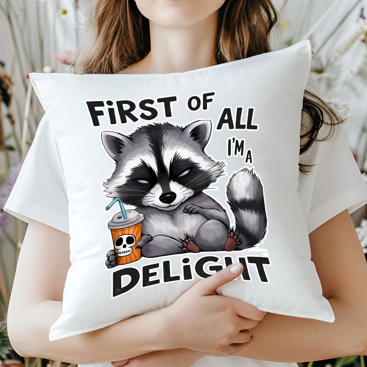 Woman hugging the First of All I’m a Delight raccoon cushion